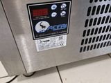 an image of a machine that is sitting on a tile floor