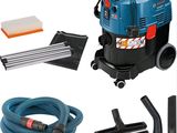 un gros plan d'un aspirateur muni d'un tuyau et d'un aspirateur