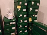 several green boxes stacked on top of each other in a room