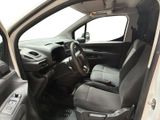 the interior of a white van with black leather seats and a steering wheel