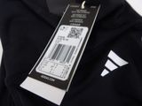 a close up of the back of a black jacket with a barcode on it