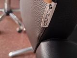 a close up of a chair with a tag on it