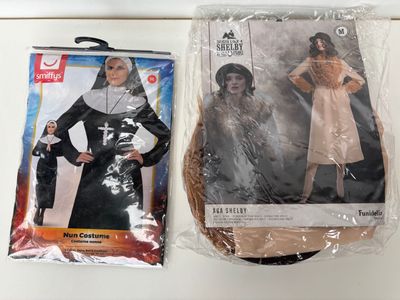 two bags of costumes on the counter next to each other