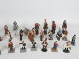 a lot of figurines that are sitting on a table