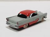 a toy car that is sitting on a white surface