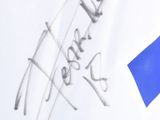 a drawing of a blue ribbon on a white shirt