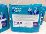 two packs of koothian and cern diapers on a table