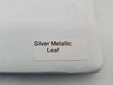 a label on the back of a laptop that says silver metallic