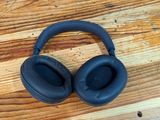 a pair of headphones sitting on a wooden table