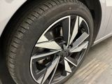 a close up of a tire on a car in a garage