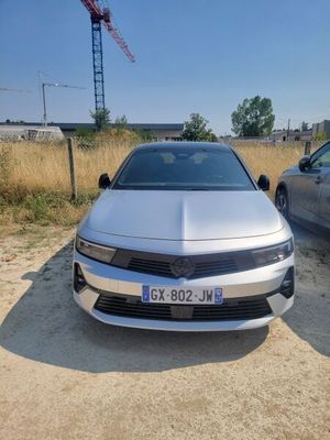 two cars parked next to each other in a parking lot