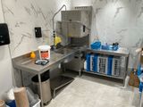 a kitchen with a stainless steel counter and a sink