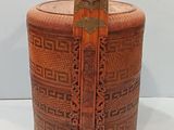 an image of a wooden box with a handle on a white surface