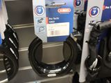 many different types of belts on display in a store