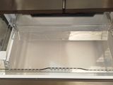 a person that is reaching into an oven door