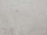 a clear acrylic display case with a single toothbrush in it