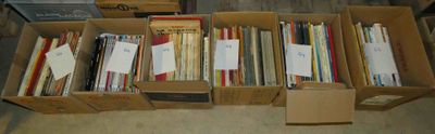 a lot of books in a box on the floor