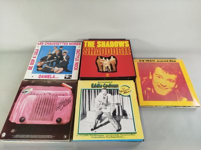several books are stacked on top of each other on a table
