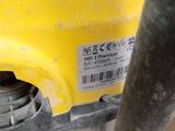 a close up of a yellow machine with a sticker on it ' s side