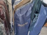 a lot of clothes hanging on a rack in a store