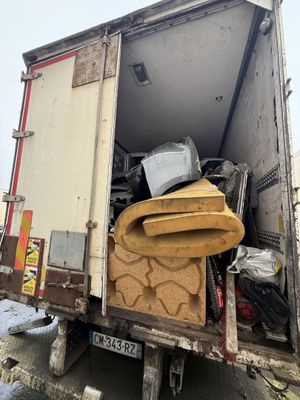 a truck that has a lot of stuff in the back of it