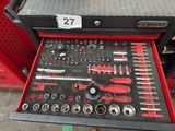 a lot of tools in a tool box on the floor