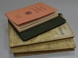 three books stacked on top of each other on a table