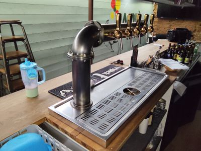 an image of a bar with a sink and a beer tap