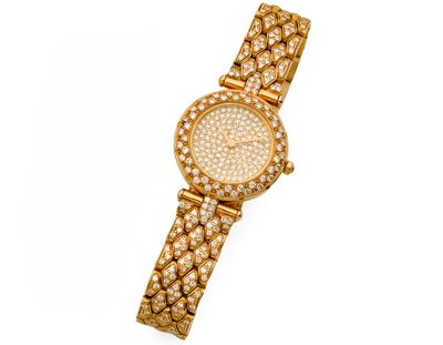 une montre-bracelet pour femme en or 18 carats sertie de diamants