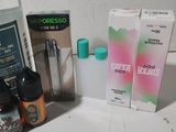 a bottle of liquid, a bottle of liquid, a bottle of liquid, and a bottle of liquid on a counter