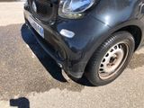 a small car that is parked in a parking lot