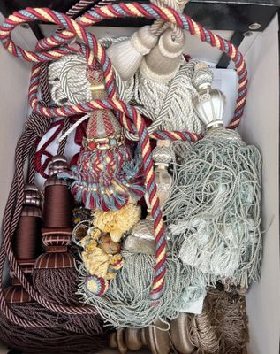 a box filled with different types of rope and other items