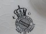 a white plate with a crown on it