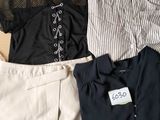 three pieces of clothing in a box on the floor