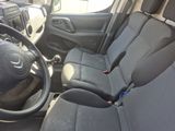the interior of a car with black seats and a steering wheel
