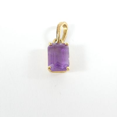 an amethorate stone pendant with a gold bail