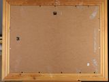 a picture of a picture frame on a wooden easel
