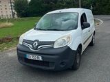 a white van that is parked on the side of the road