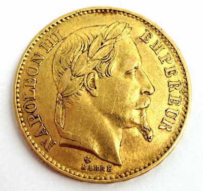l'image d'une pièce d'or sur laquelle figure le visage d'un homme