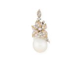 an image of a pearl and diamond pendant