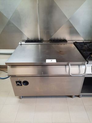 a stainless steel stove and oven in a commercial kitchen