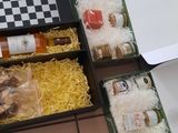 many trays of food that are on the table