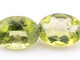pair of two green quartzite gems on a white background
