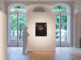 a sculpture of a man standing in a room with a painting on the wall
