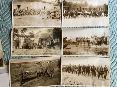 several old black and white photos of soldiers and horses in a field