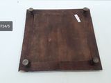 a wooden tray with a tag on it on a white surface