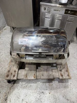 a toaster sitting on a pallet next to a stove