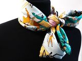 a close up of a neck scarf on a mannequin