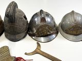 five different types of helmets on a white surface