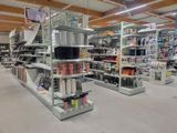many shelves in the store that have various items on them